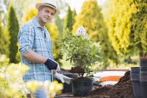 Professional landscapers installing a patio in Chelsea